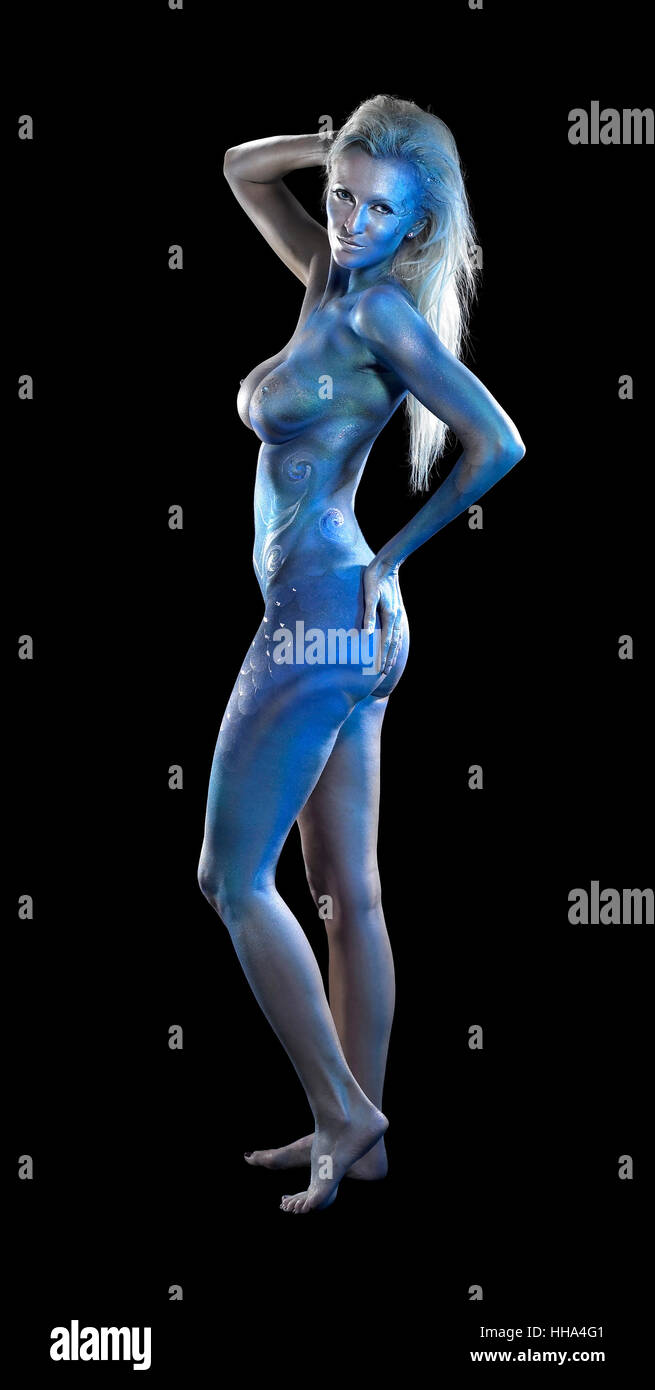 mystic mermaid theme showing a blue  bodypainted woman posing in black back Stock Photo