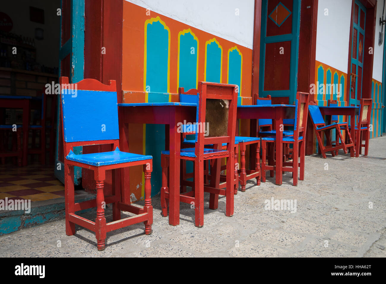 Colorful patio chairs and tables in El Jardin, Colombia Stock Photo