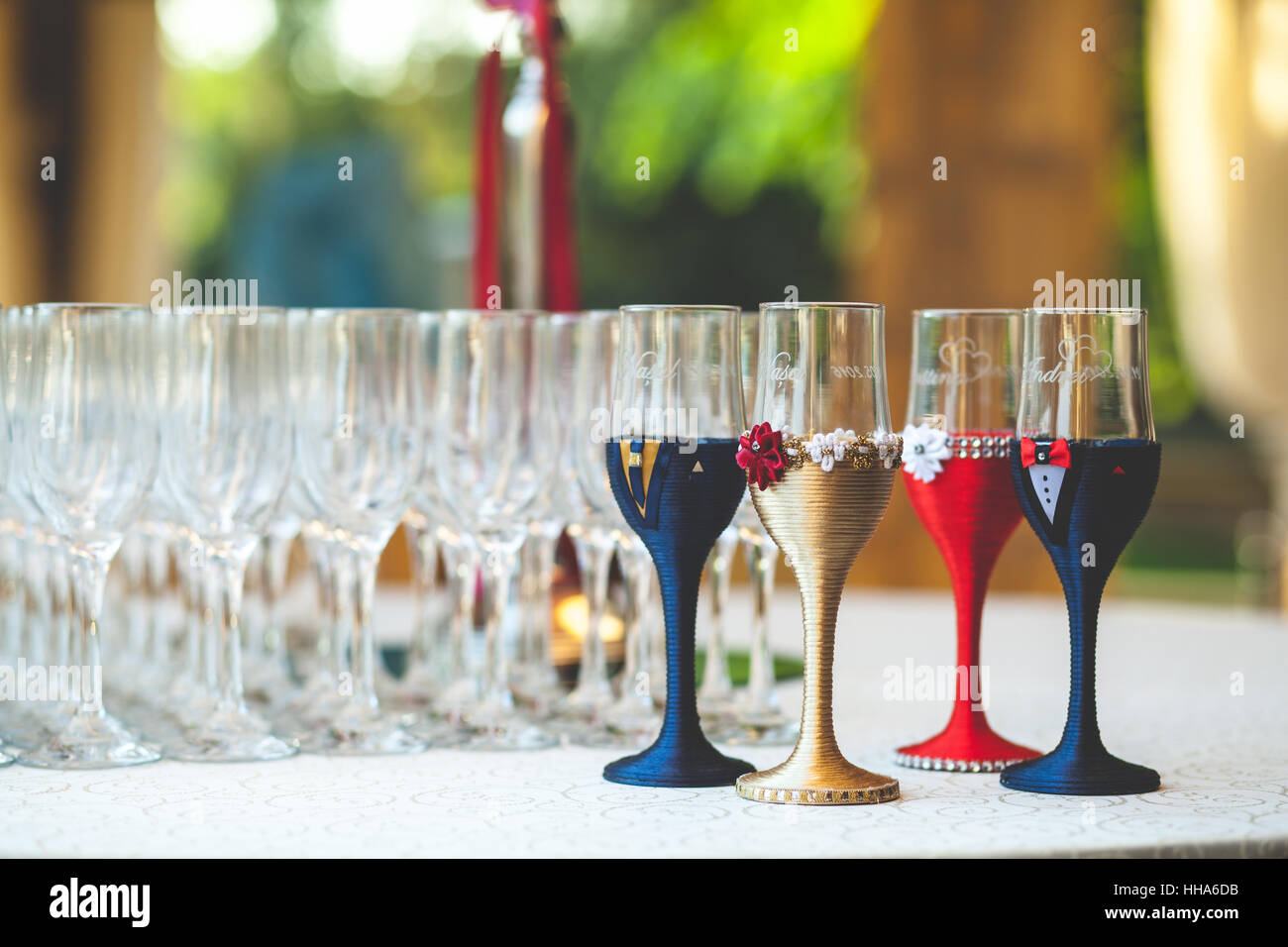 wedding champagne glasses decorations for bride groom and witnesses on a table Stock Photo