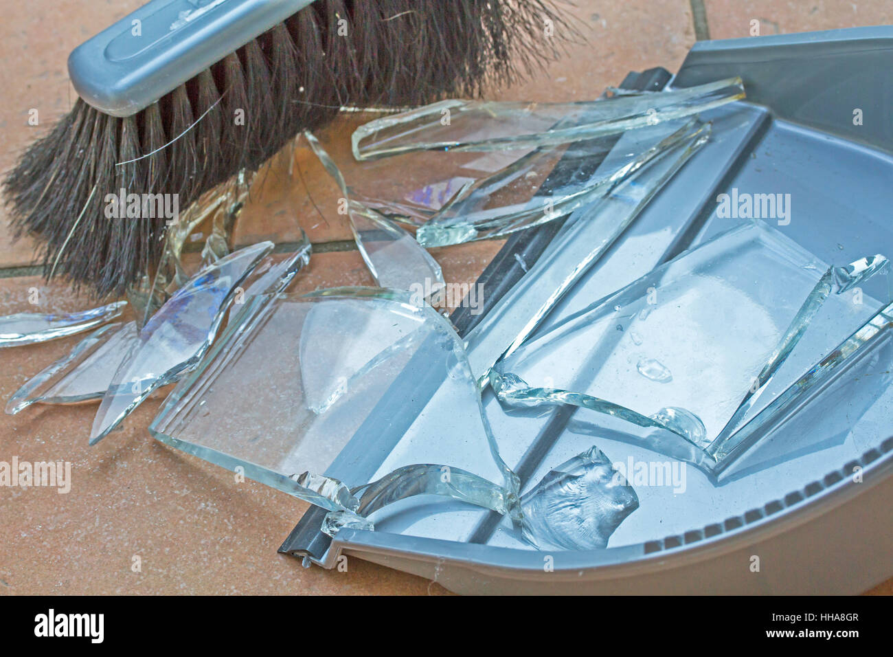 broken, mud, shards, broken bits of glass, hand brush, glassy, hand