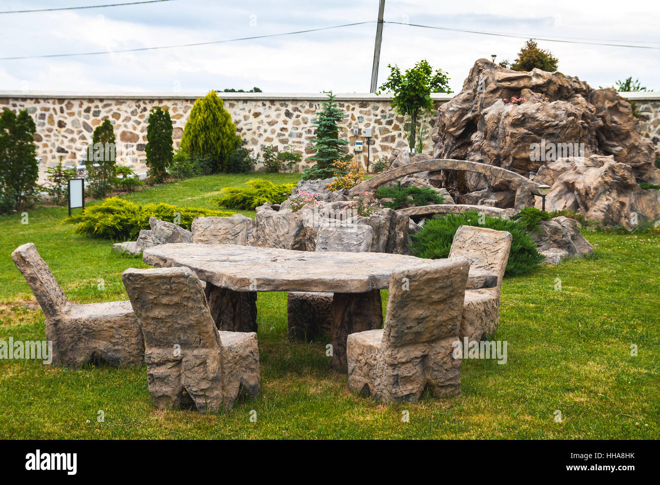 chairs and table carved in stone Stock Photo