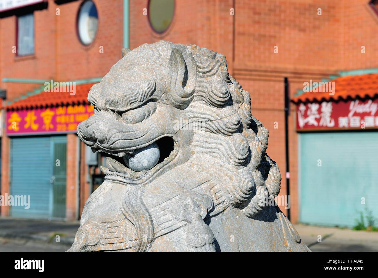A Chinese guardian lion in Chicago's Chinatown reflects the local cultural influence. Statues of guardian lions. Chicago, Illinois, USA. Stock Photo