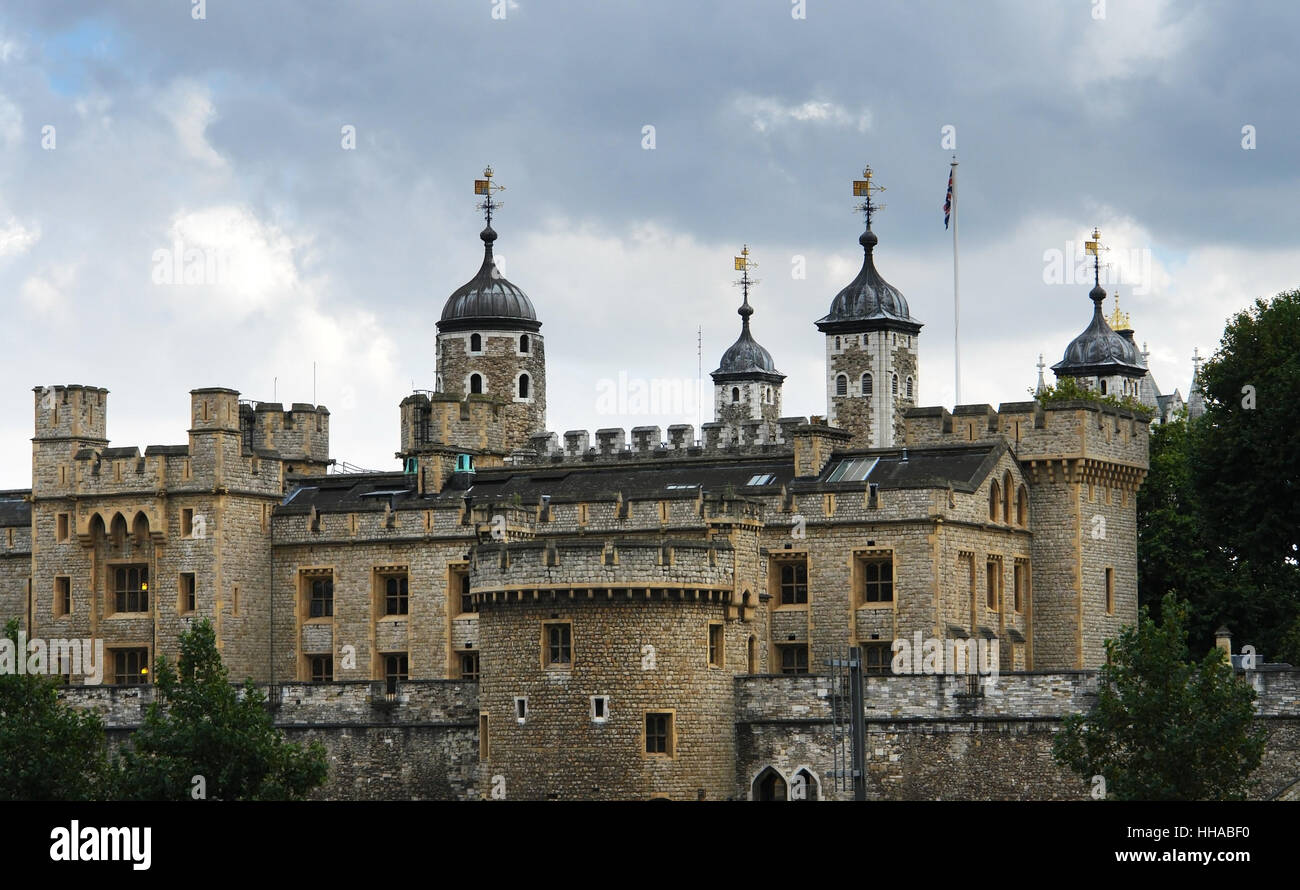 detail of a castle named Tower of London in England in front of cloudy sky Stock Photo