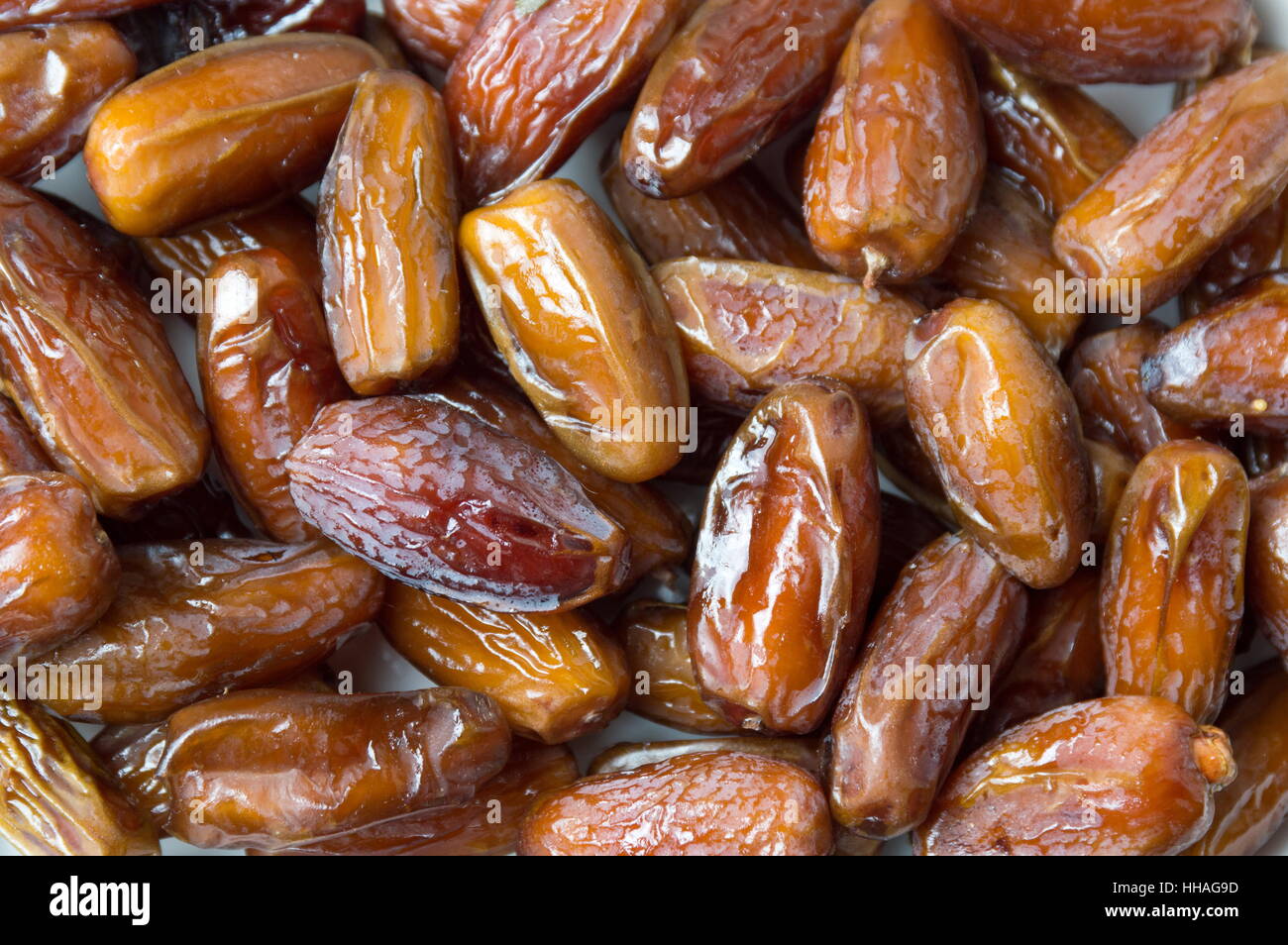 Bunch of dry date fruits forming a background Stock Photo