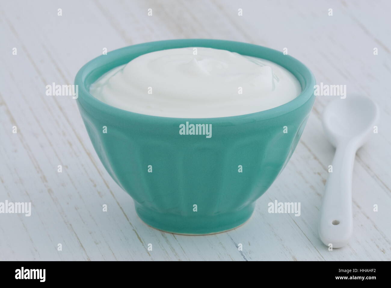 Delicious, nutritious and healthy fresh plain greek yogurt on antique