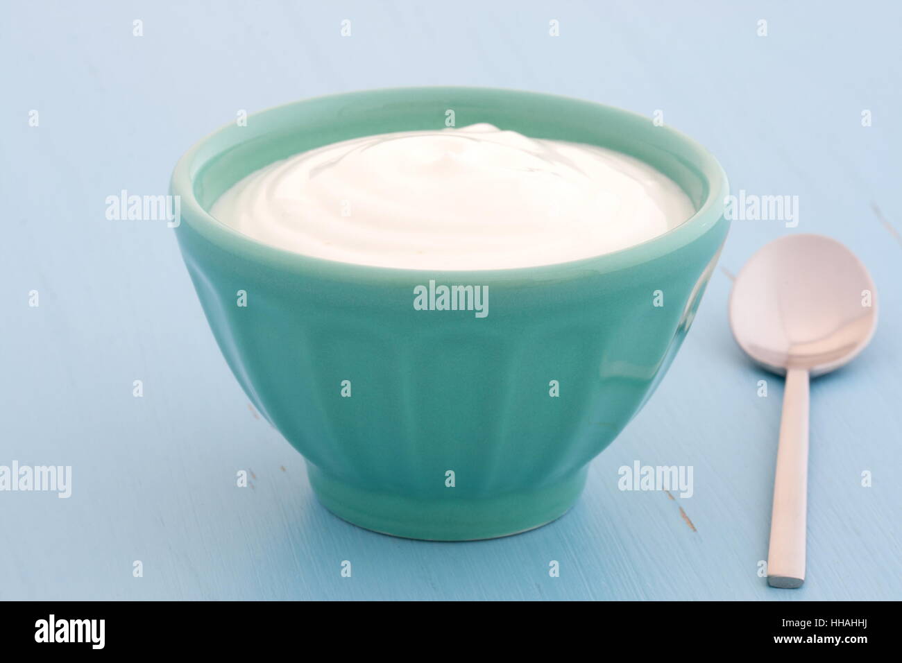 Delicious, nutritious and healthy fresh plain greek yogurt on antique