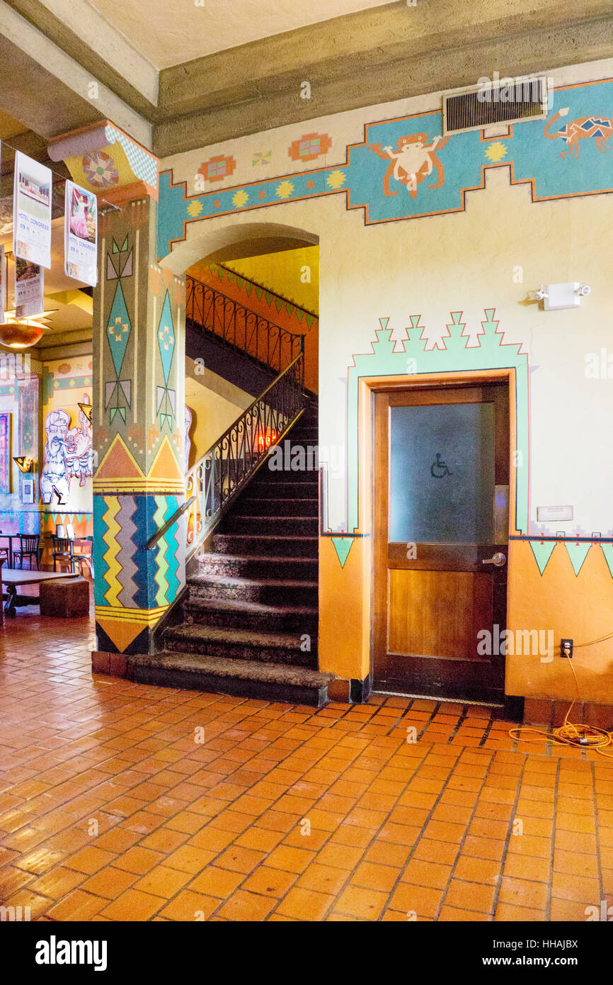 lobby & grand stair restored Congress Hotel with stair column wall frieze & wainscot painted with richly colored Southwest Indian geometric patterns Stock Photo