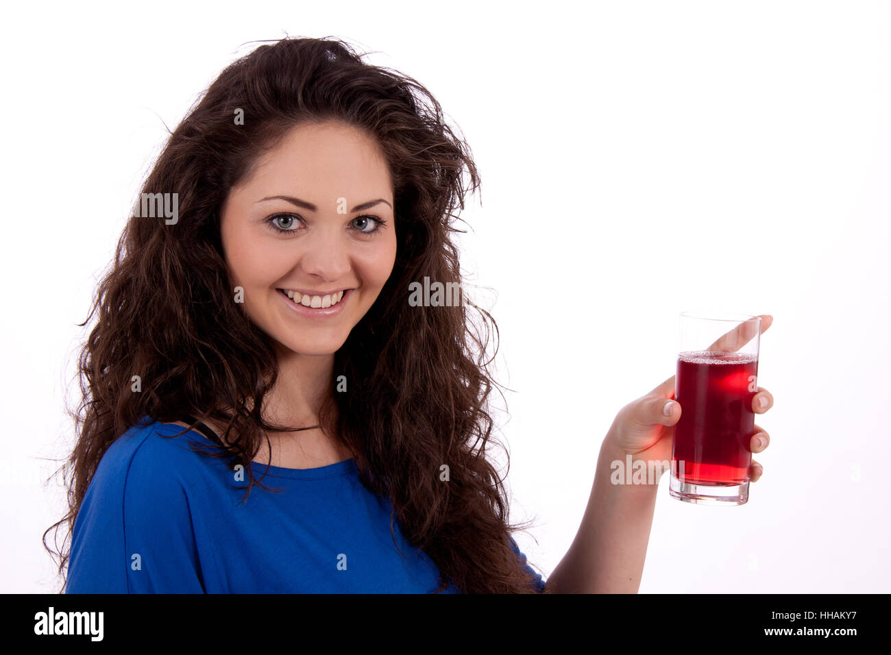 young beautiful woman drinking red juice Stock Photo