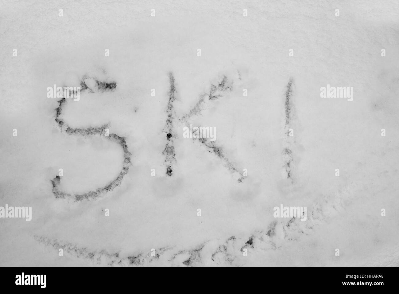 Word ski written in snow Stock Photo - Alamy