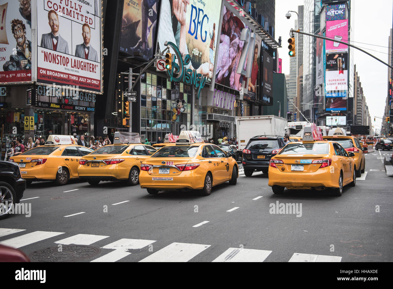 A busy road in Times Square, NYC. New York City yellow taxis in traffic