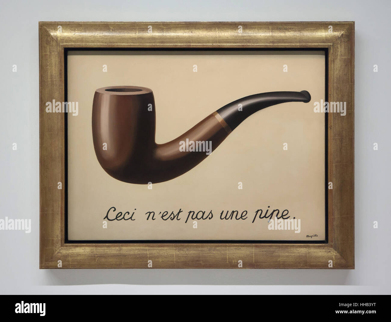 Painting 'La trahison des images' ('The Treachery of Images') by Belgian surrealist artist Rene Magritte (1929) on display at his retrospective exhibition in the Centre Pompidou in Paris, France. The French inscription 'Ceci n'est pas une pipe' means 'This is not a pipe'. The exhibition entitled 'Rene Magritte. The Treachery of Images' runs till 23 January 2017. After that the reformulated version of the exhibition will be presented at the Schirn Kunsthalle in Frankfurt am Main, Germany, from 10 February to 5 June 2017. Stock Photo