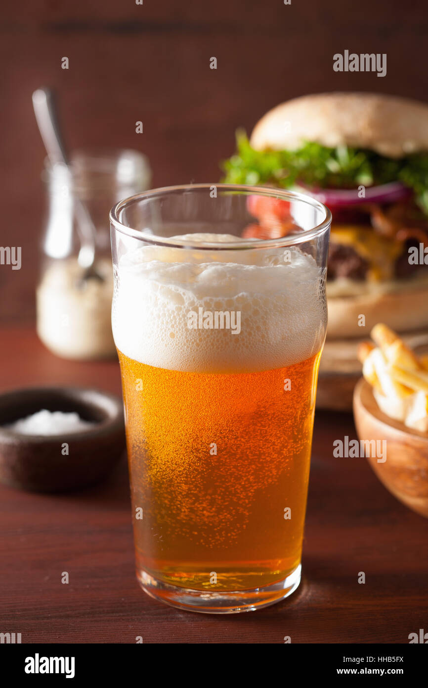 pint glass of india pale ale beer and fastfood Stock Photo