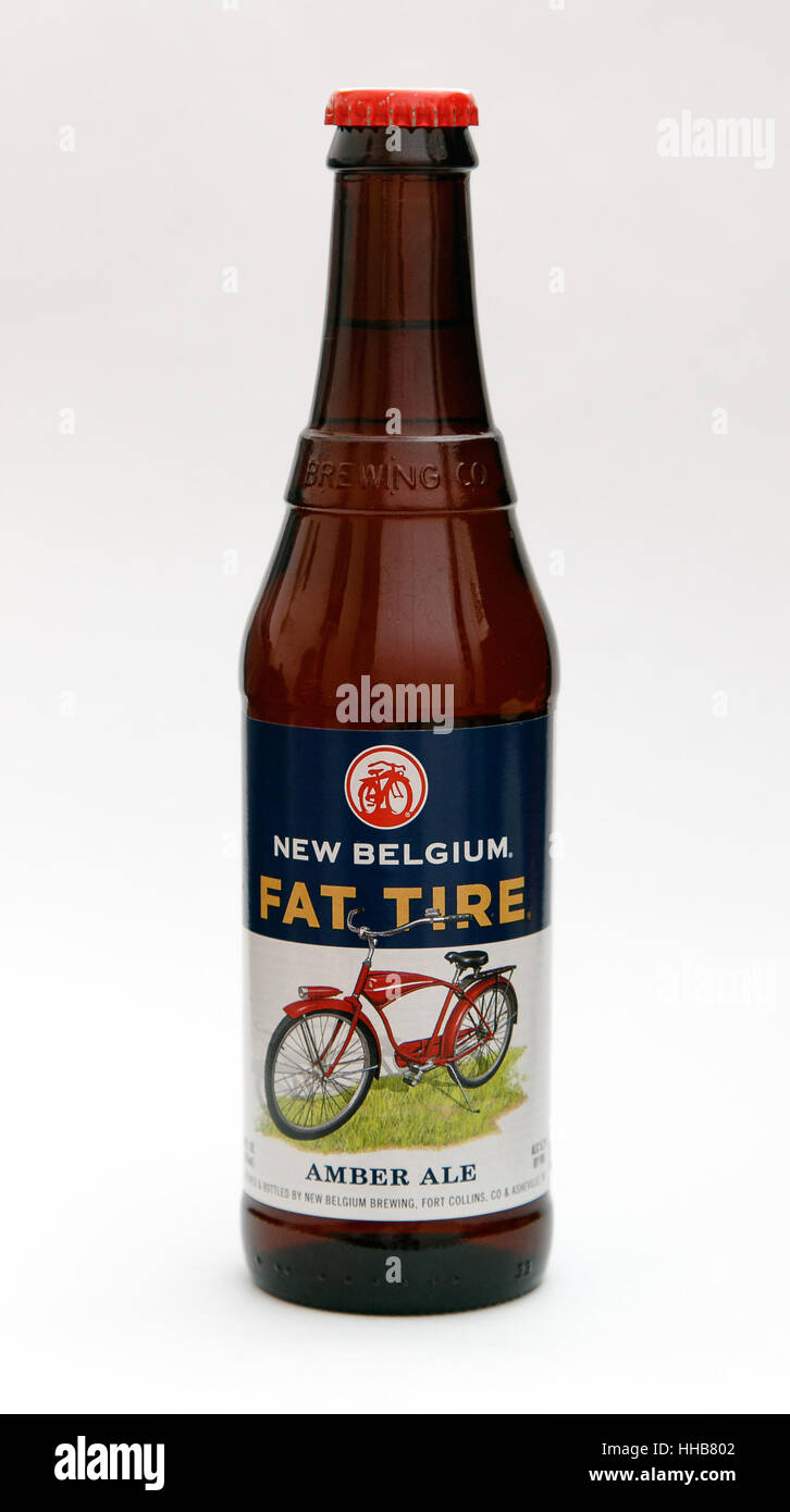 A bottle of Fat Tire amber ale is seen against white background. Stock Photo