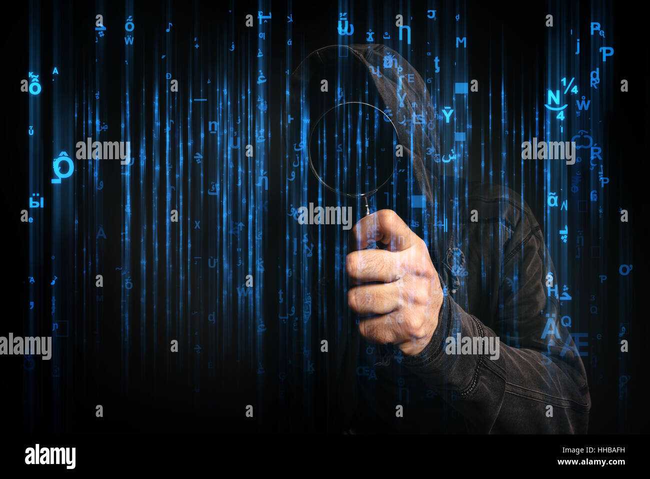 Computer hacker with hoodie in cyberspace surrounded by matrix code, online internet security, identity protection and privacy Stock Photo
