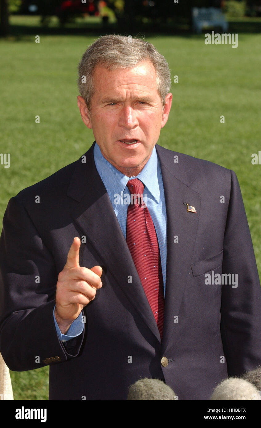 Washington, DC - September 16, 2001 -- United States President George W. Bush returns from a week-end at Camp David on Sunday, September 16, 2001. In remarks to the press as walked to the White House, President Bush warned 'We need to be alert to the fact Stock Photo
