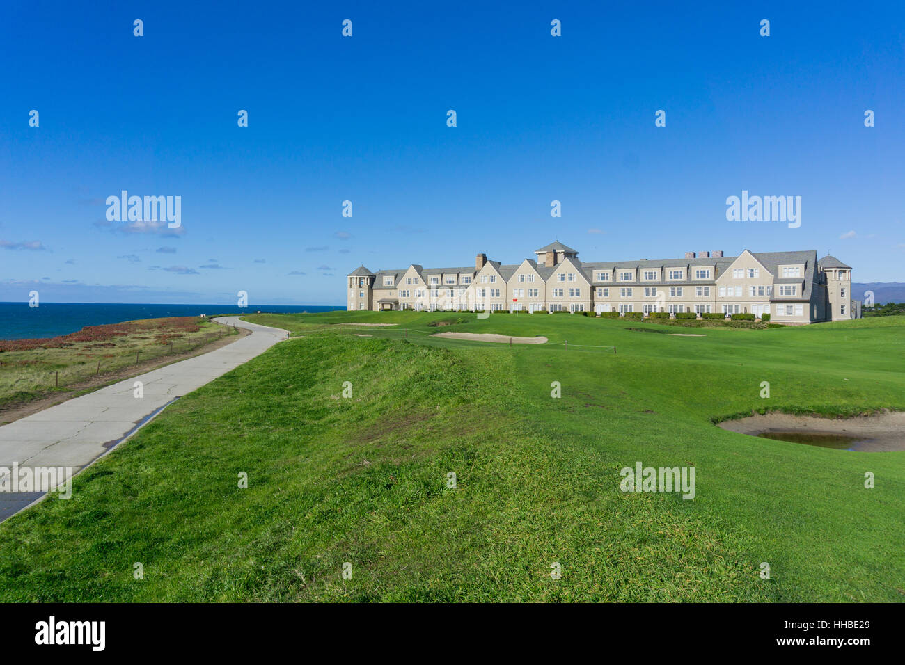 Resort and golf course putting green on the cliffs by the pacific ocean, Half Moon Bay, California Stock Photo