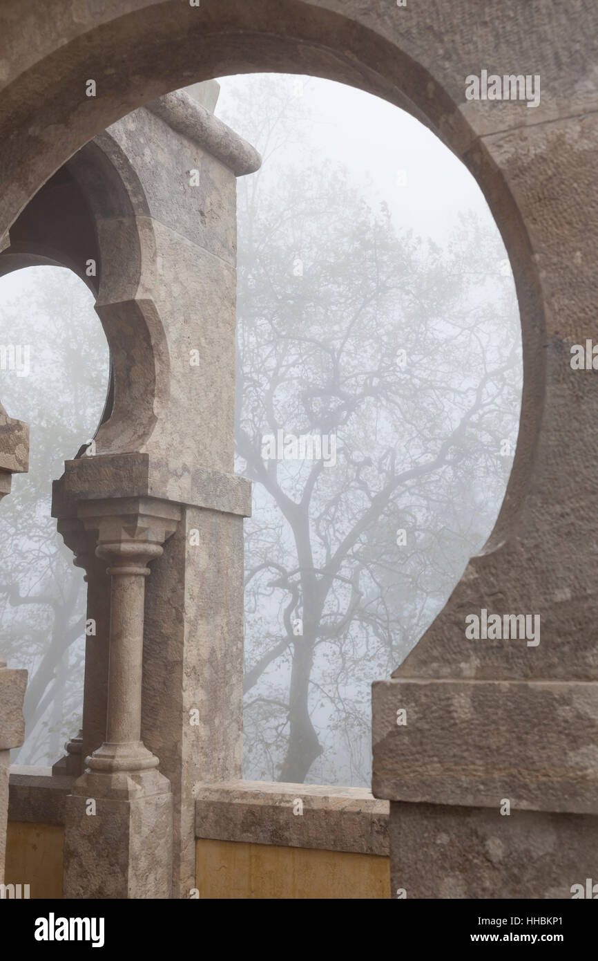Sintra, Portugal: Horseshoe arch on a foggy morning at Pena Palace. Stock Photo