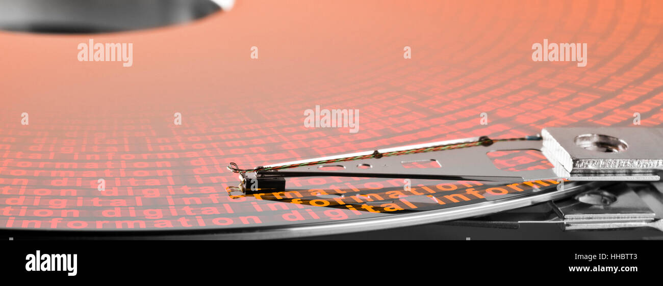 detail shot of a hard disk platter with actuator arm.Allegory regarding digital information Stock Photo