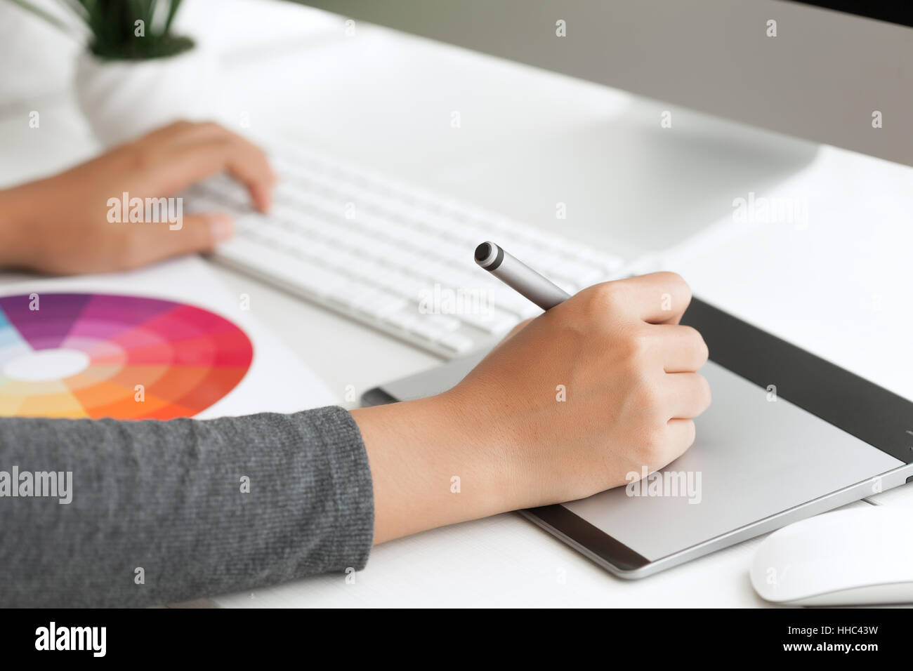 close up graphic design using digital pen tablet on desk workspace Stock Photo