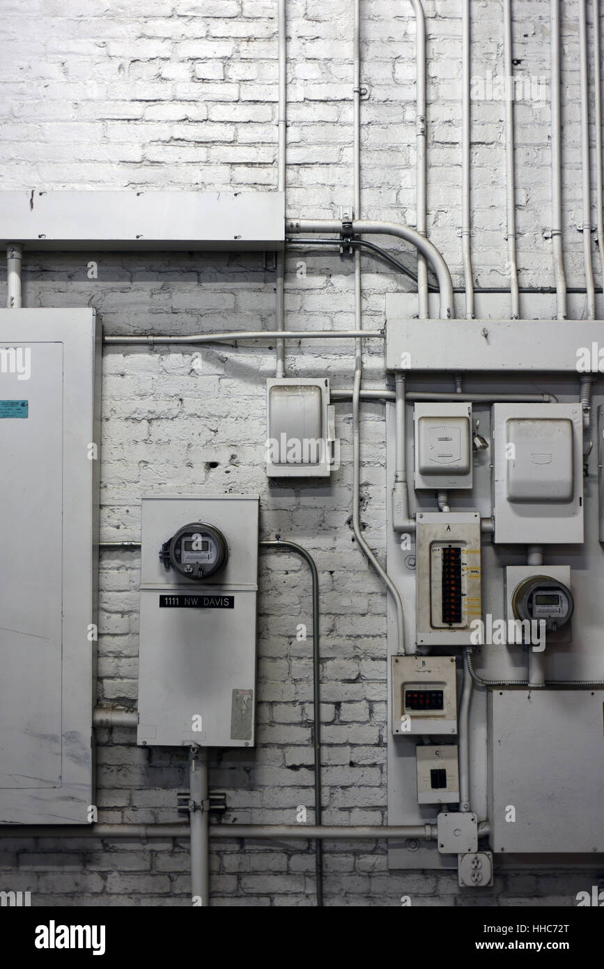 Electrical wiring and boxes on a painted brick wall Stock Photo Alamy