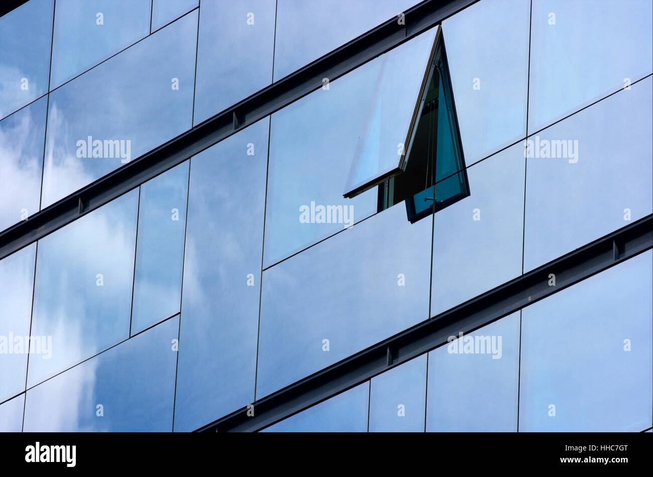 Modern office building with cloud and sky reflection Stock Photo - Alamy