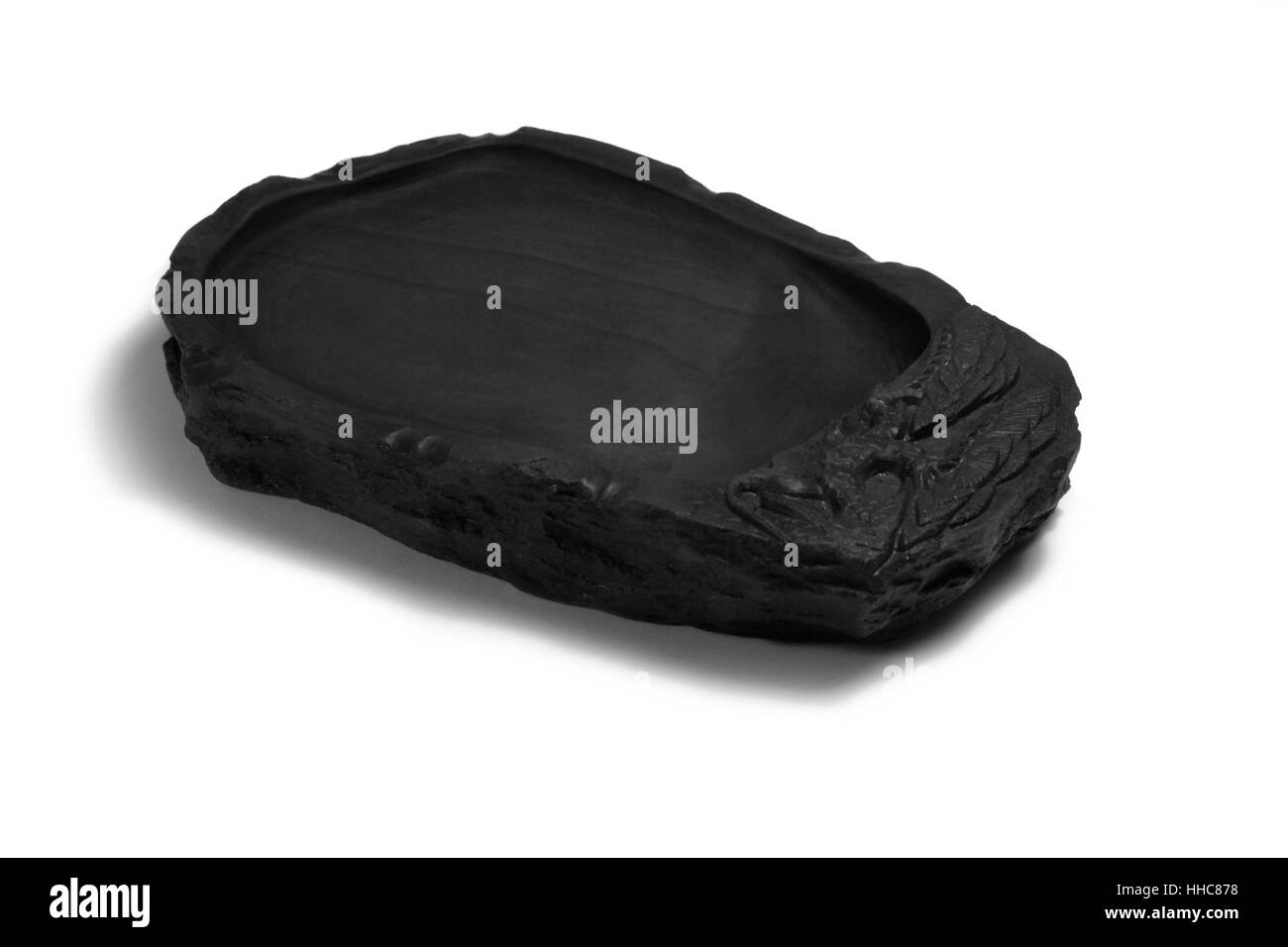 studio photography of a black chinese ink stone isolated on white with shadow Stock Photo