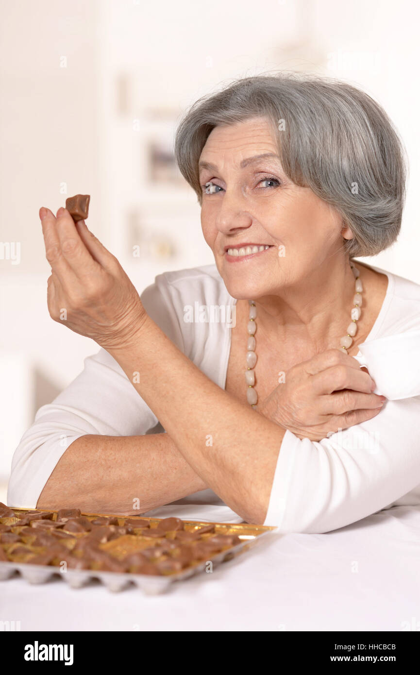 woman eating candies Stock Photo