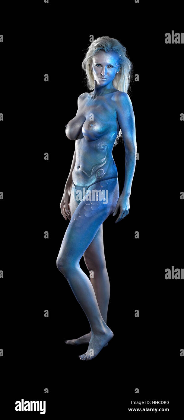 mystic mermaid theme showing a blue bodypainted woman posing in black back Stock Photo