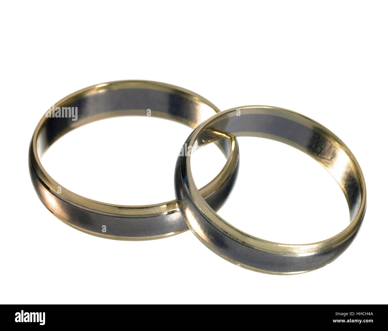studio photography of two shiny metallic wedding rings on each other, isolated on white Stock Photo