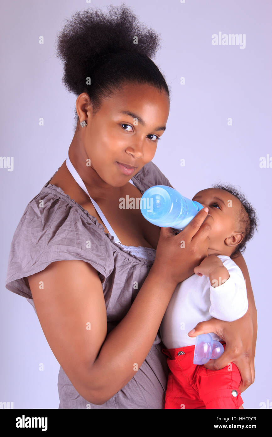 Attractive African American Mother Holding Newborn Baby Boy Stock