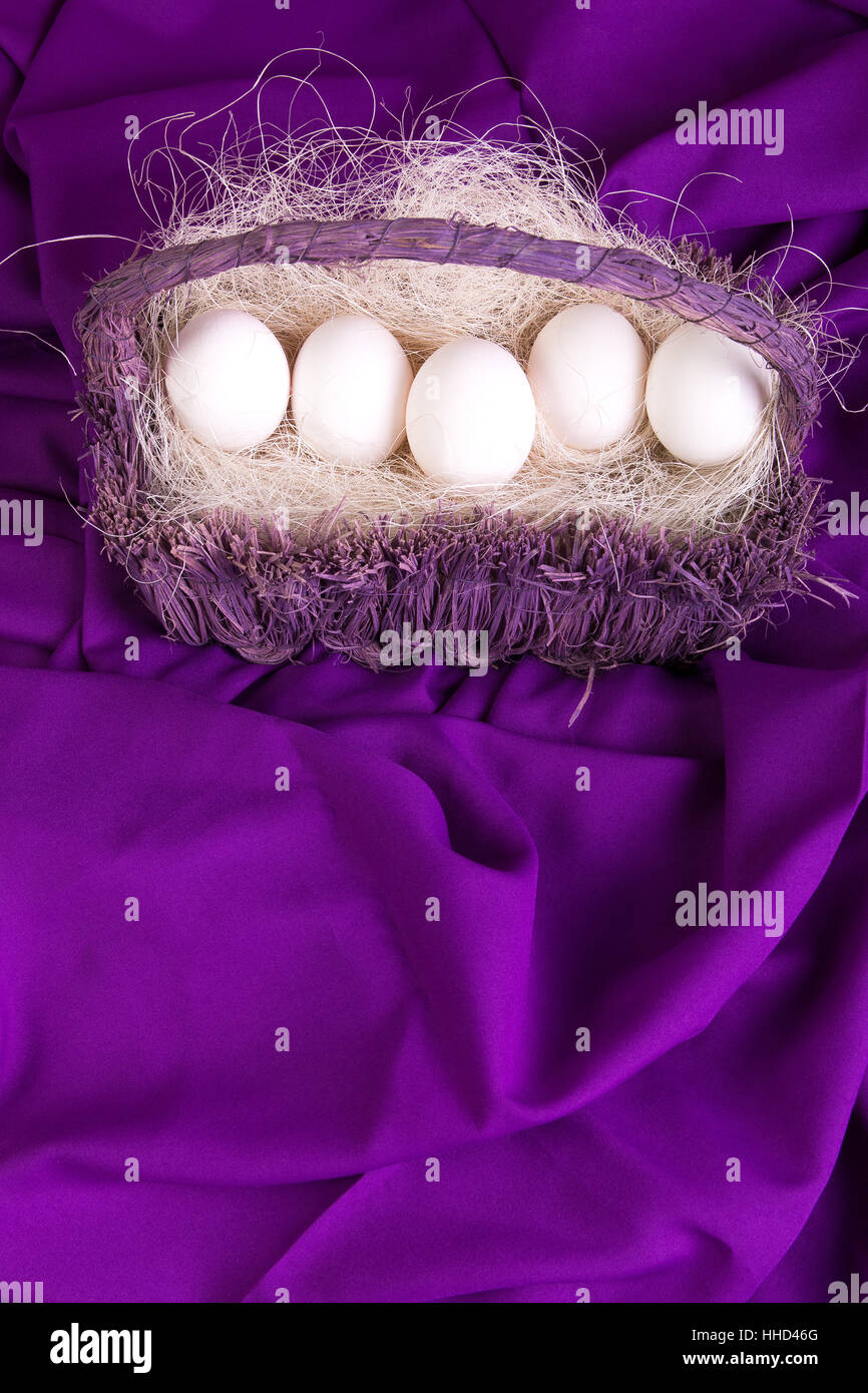Easter. White eggs in purple basket on violet background Stock Photo ...