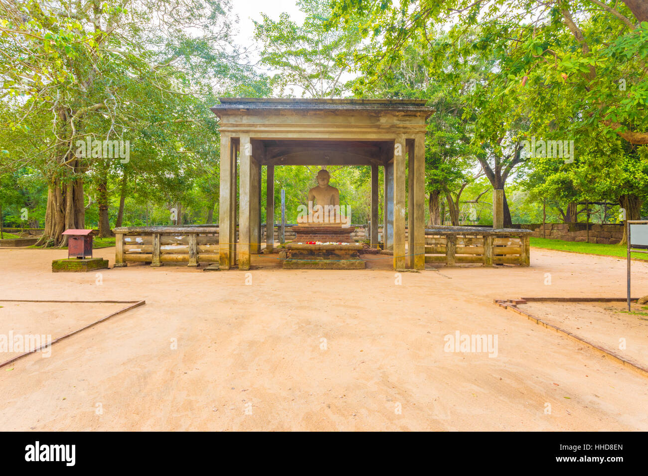 Dirt footpath leading to sacred Samadhi Buddha Statue in ancient capitol of Anuradhapura in Sri Lanka. Horizontal Stock Photo