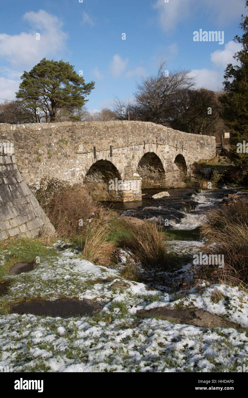 The  East Dart River and road bridge built in the 1700's at Postbridge on Dartmoor in Devon England UK Stock Photo