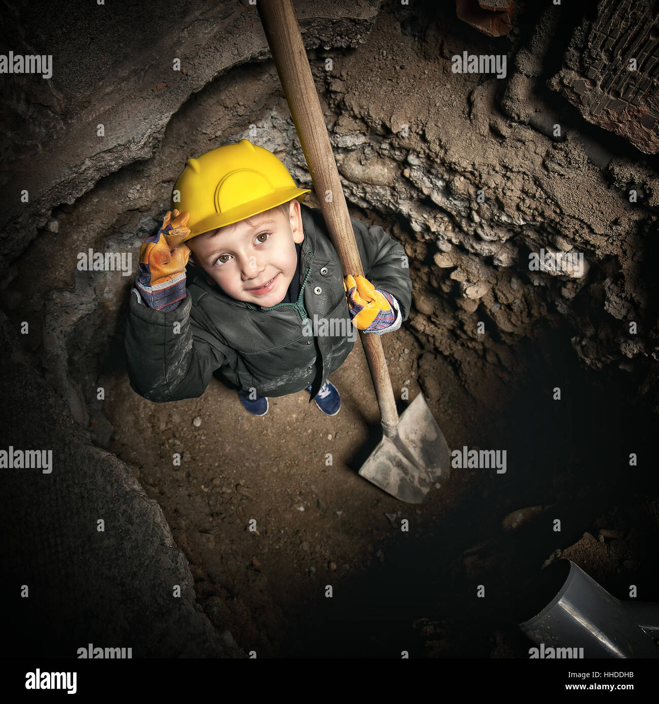 little handyman at work in construction site Stock Photo