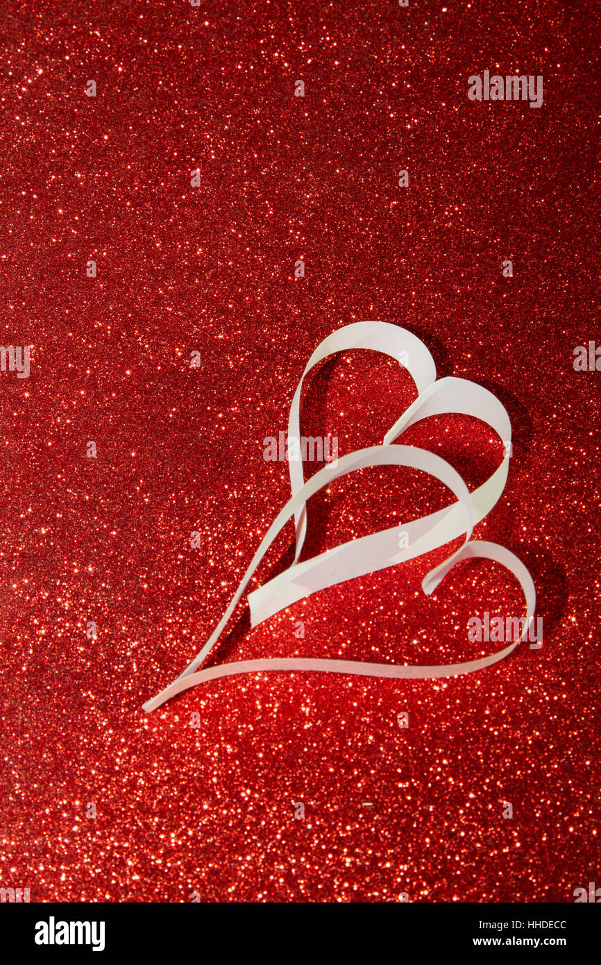 Two white hearts from paper on red shining background Stock Photo - Alamy