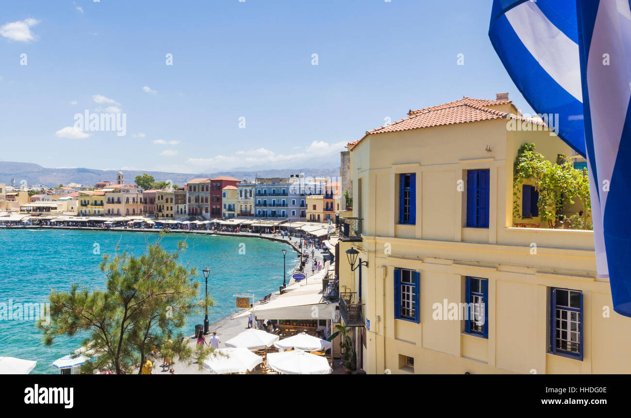 The Venetian harbour of Chania surrounded by cafés and restaurants along the waterfront promenade, Crete, Greece Stock Photo