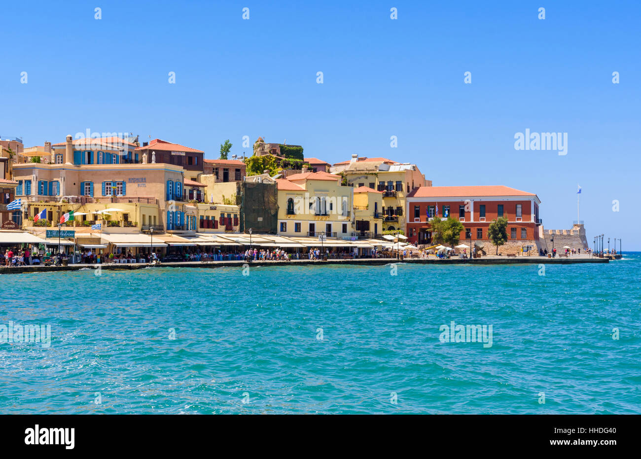 Buildings along the waterfront promenade around the old outer Venetian harbour of Chania, Crete, Greece Stock Photo