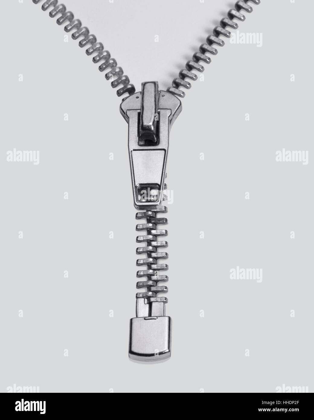 studio photography of a long zipper half closed, in light back Stock ...