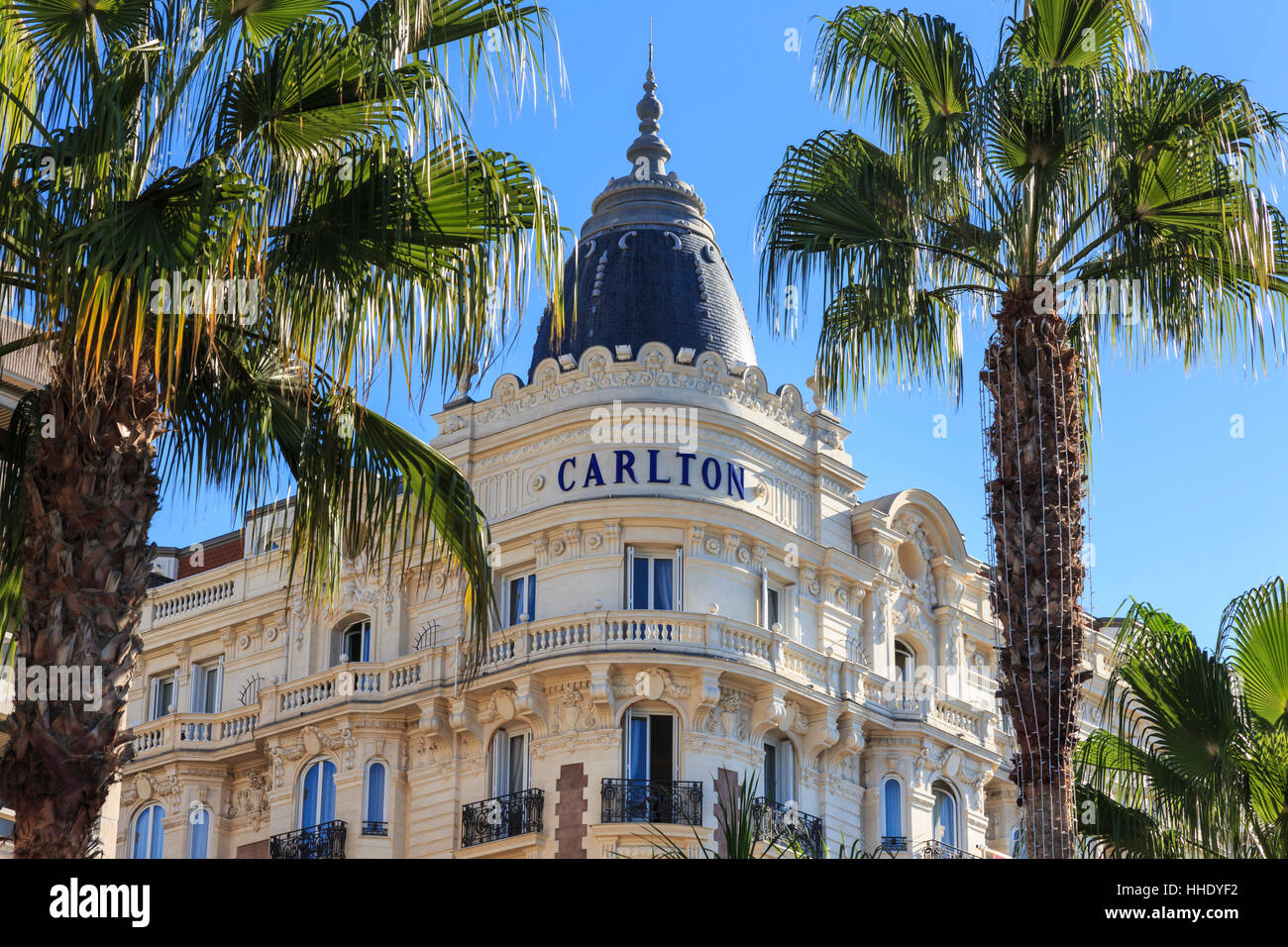 Carlton Hotel and palm trees, La Croisette, Cannes, French Riviera, Cote d'Azur, Alpes Maritimes, Provence, France Stock Photo