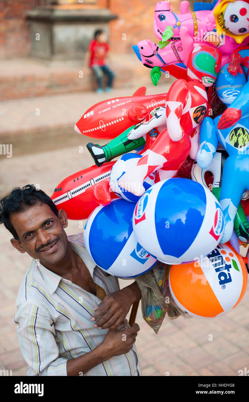 A Man Selling Inflatable Toys In Patan A Historical Part Of Stock
