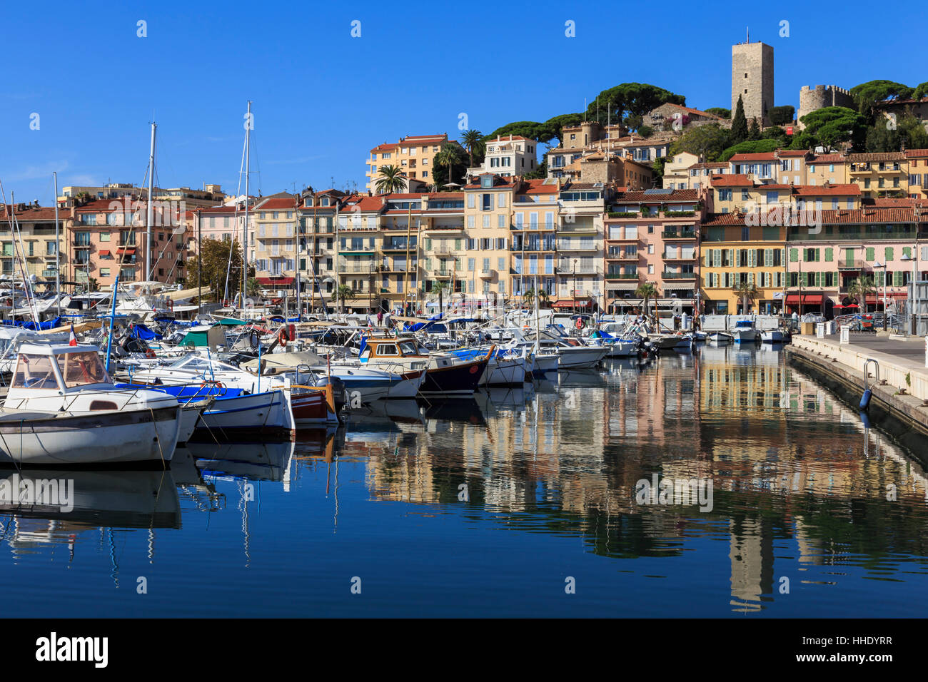 Reflections of boats and Le Suquet, Old (Vieux) port, Cannes, Cote d'Azur, Alpes Maritimes, Provences, France, Mediterranean Stock Photo