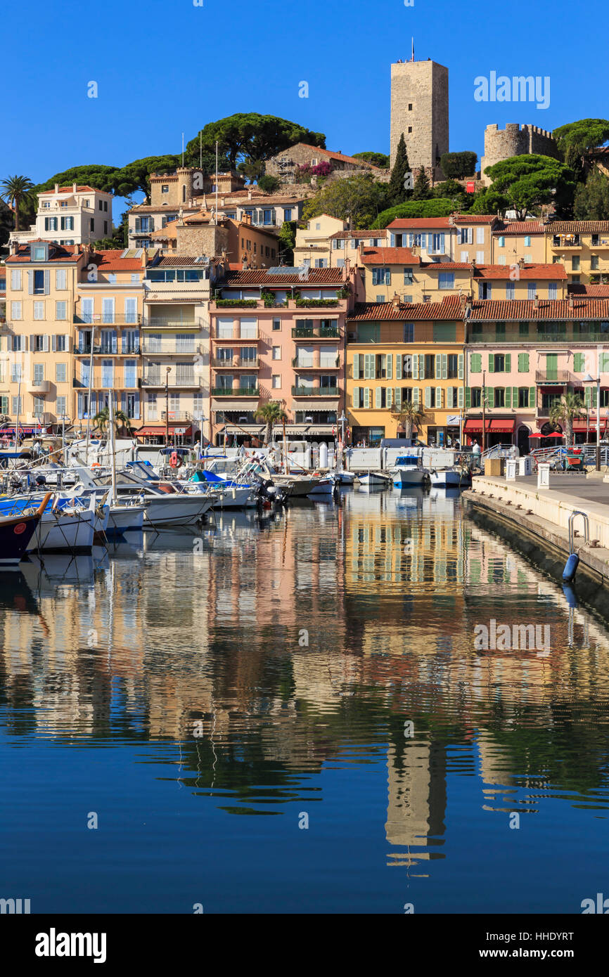 Reflections of boats and Le Suquet, Old (Vieux) port, Cannes, Cote d'Azur, Alpes Maritimes, Provence, France, Mediterranean Stock Photo