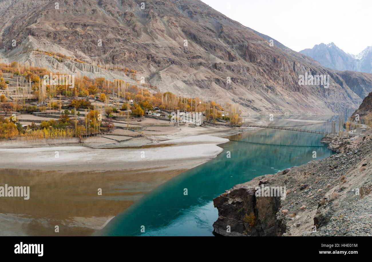 Gupis village on the banks of Khalti Lake which is part of the Gilgit River, Ghizer District, in north Pakistan Stock Photo