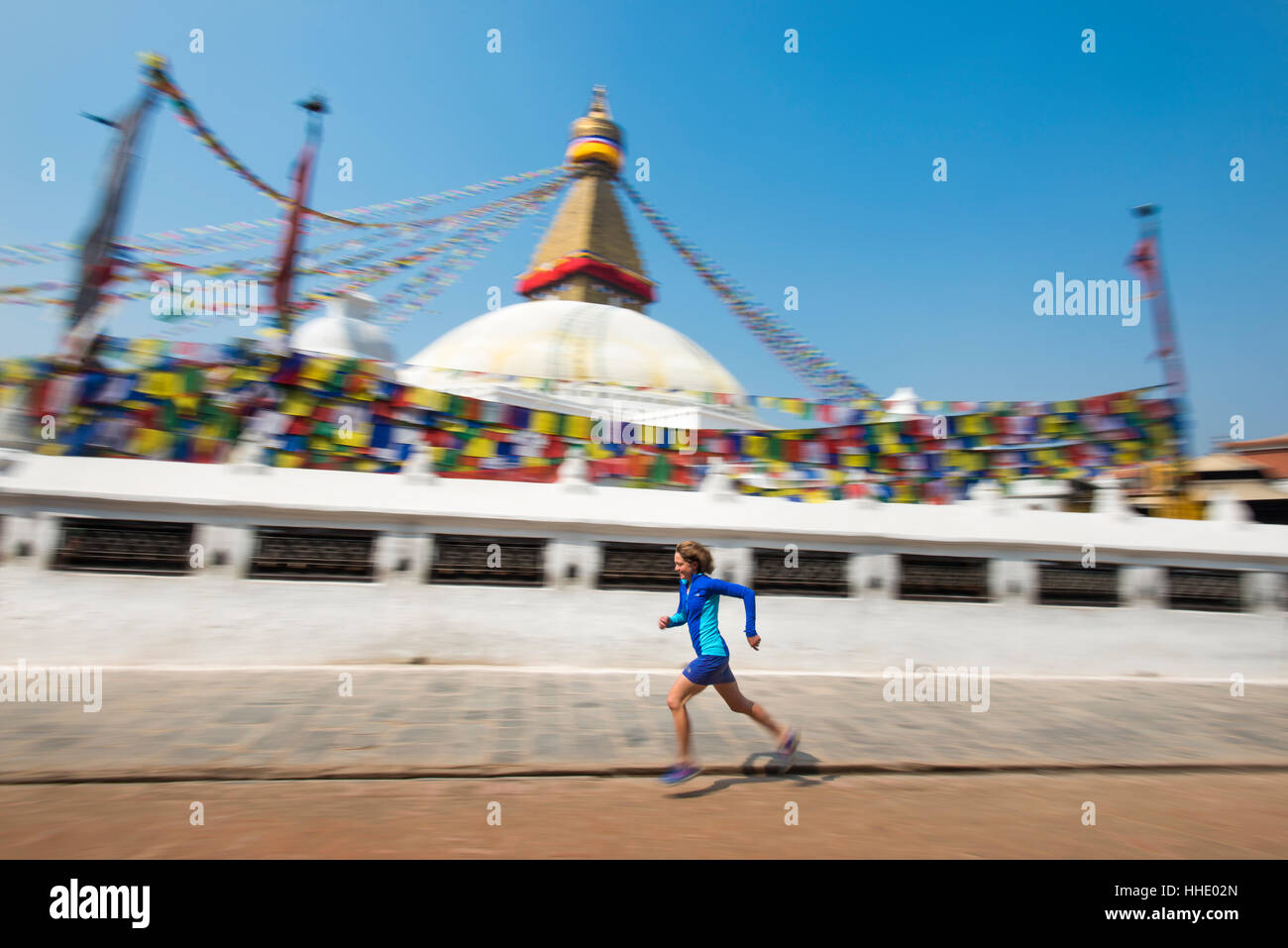 Marathon Ultra Runner Lizzy Hawker running around Bouddha (Boudhanath) (Bodnath) Stupa in Kathmandu, Nepal Stock Photo