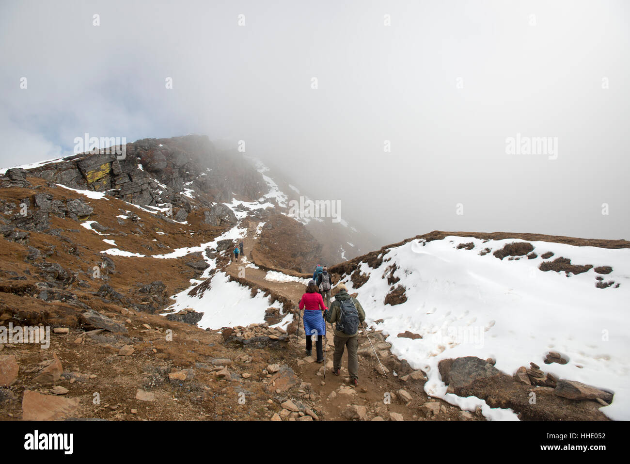 Hiking in the mist on the trail between Sian Gompa and Gosainkund in the Langtang region, Nepal Stock Photo