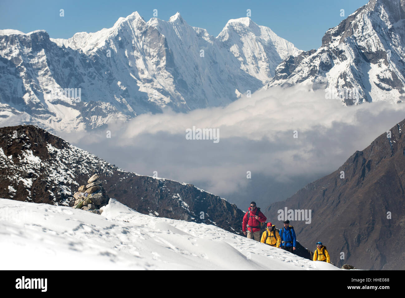 A team of four climbers return to base camp after climbing Ama Dablam in the Nepal Himalayas, Khumbu Region, Nepal Stock Photo