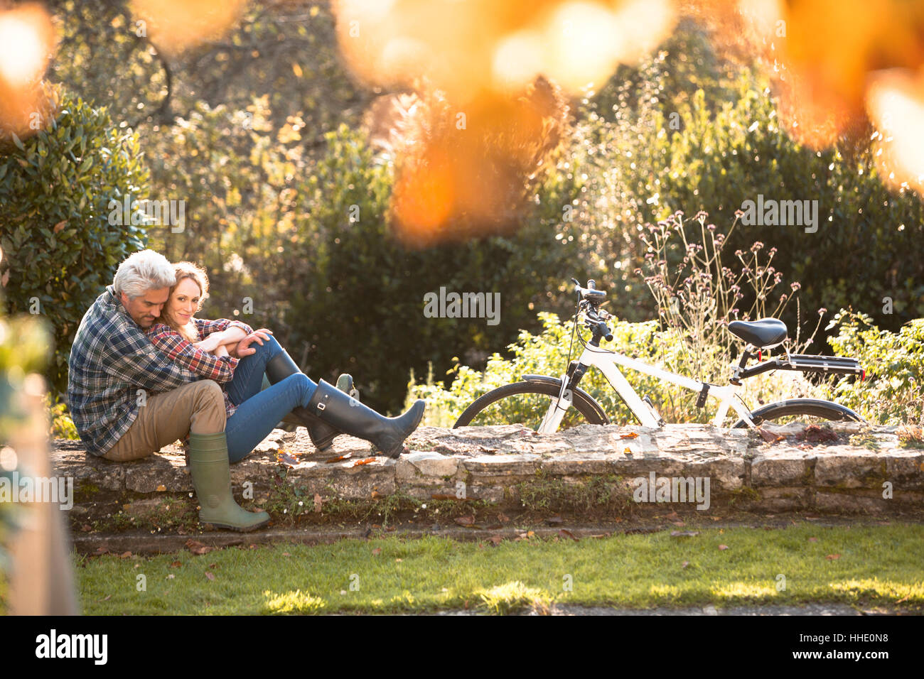A man sitting on a stone wall hires stock photography and images Alamy