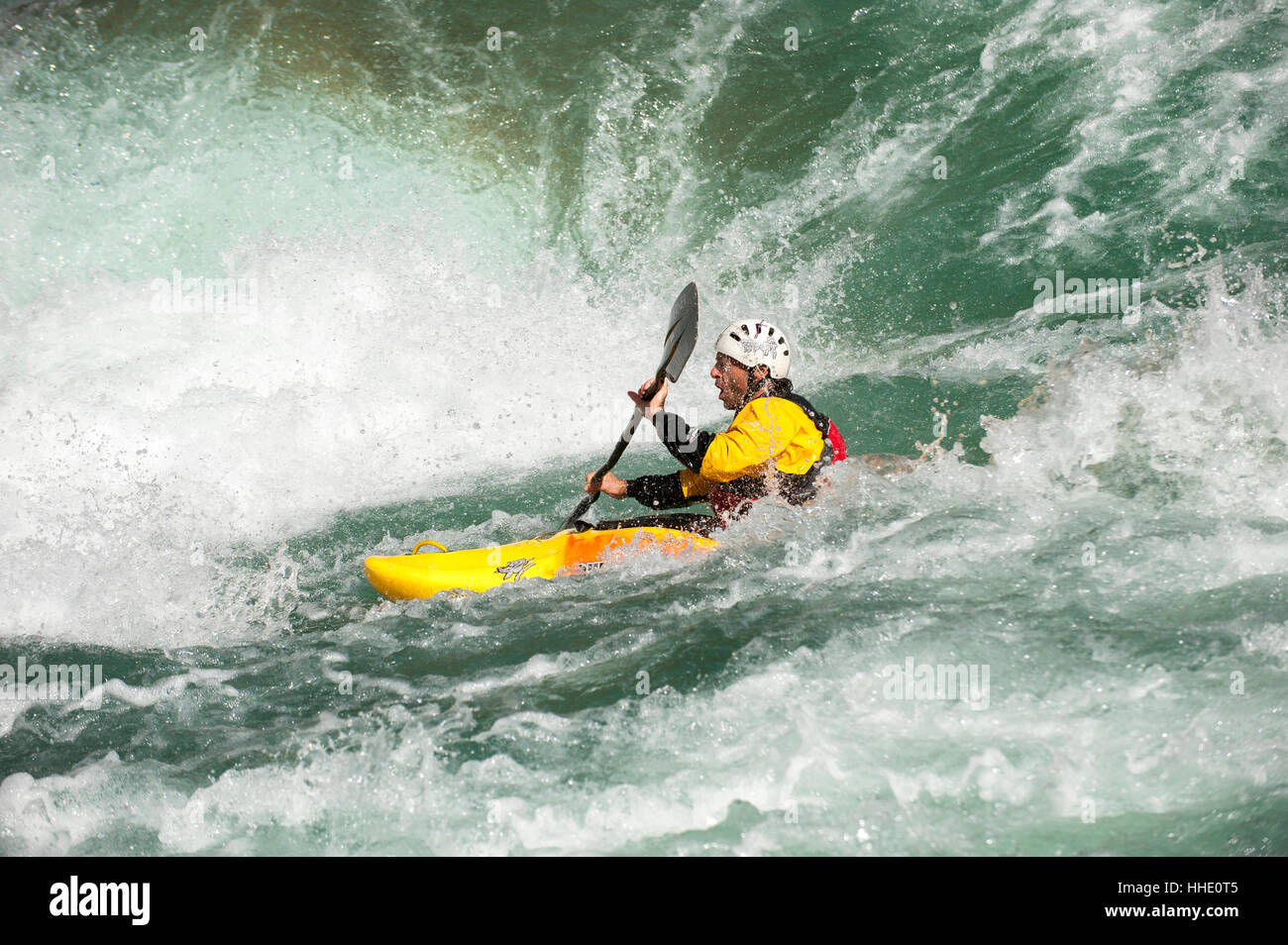 A kayaker negotiates his way through the rapids on the Karnali River, west Nepal Stock Photo