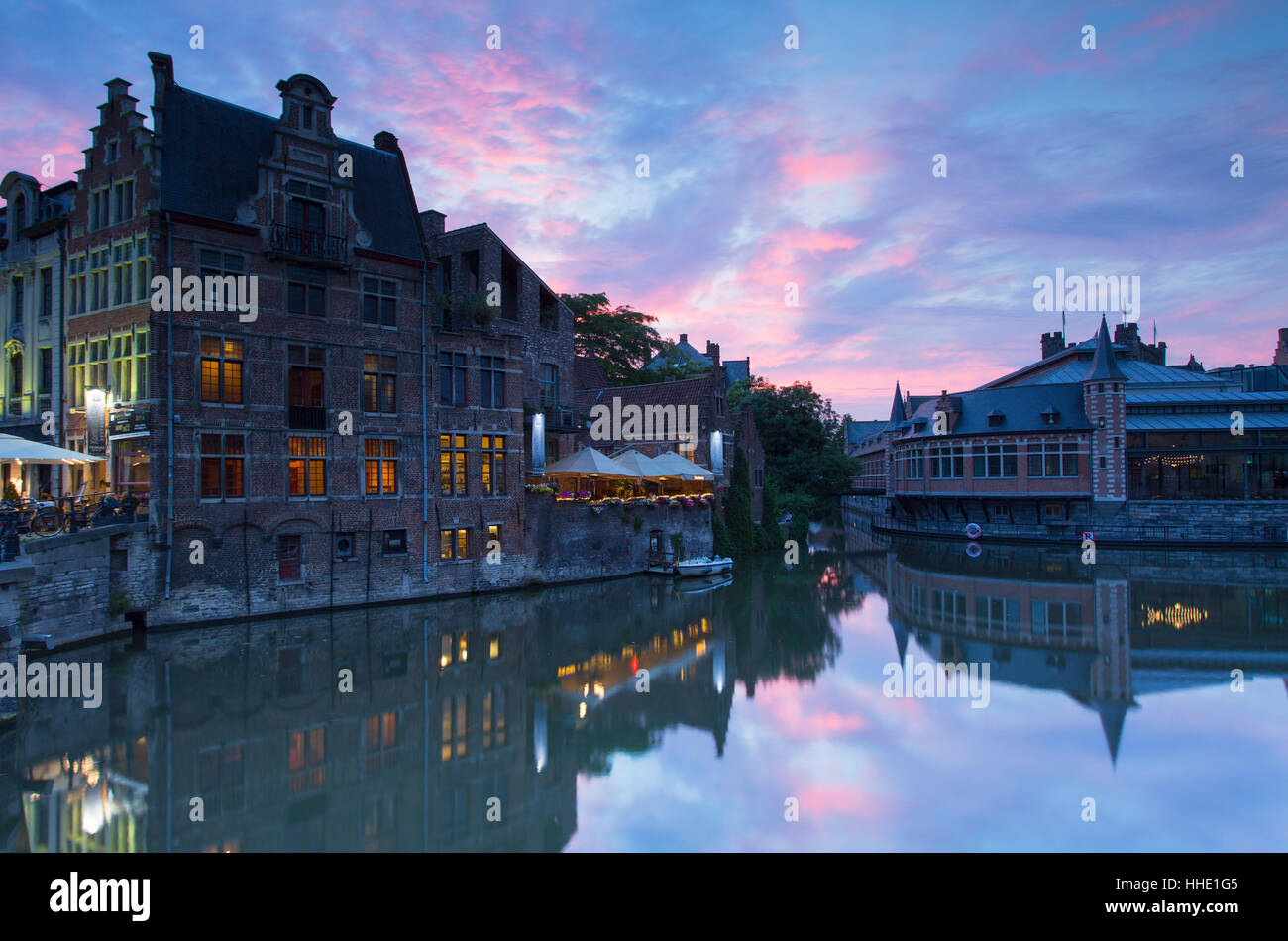 Canalside cafes on Leie Canal at sunset, Ghent, Flanders, Belgium Stock Photo