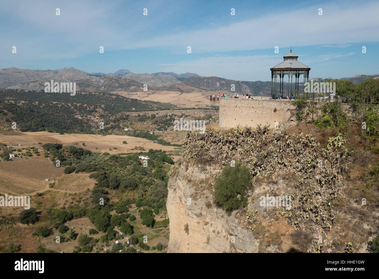 Tourists viewing the valley from the cliff top at,Ronda,Andalucia,Andalusia, Spain Stock Photo